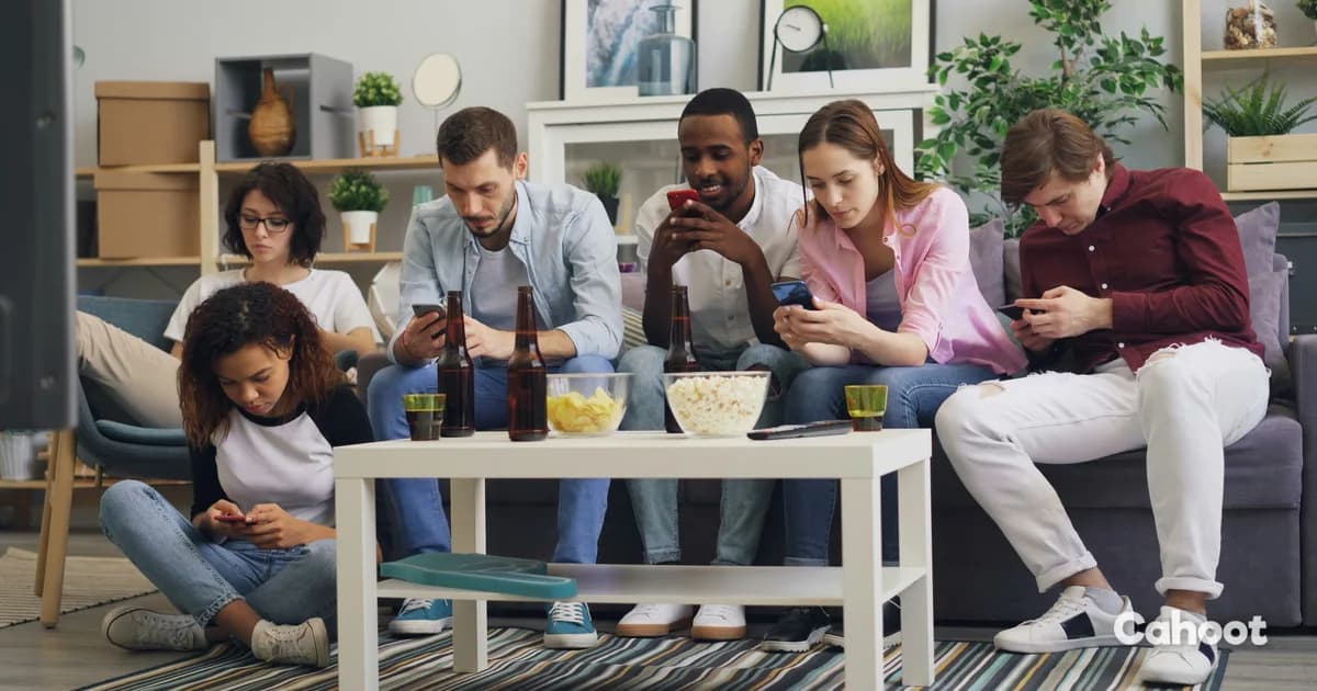 A group of friends on a couch with drinks and snacks, each on their phone, figuring out where to go for the night.